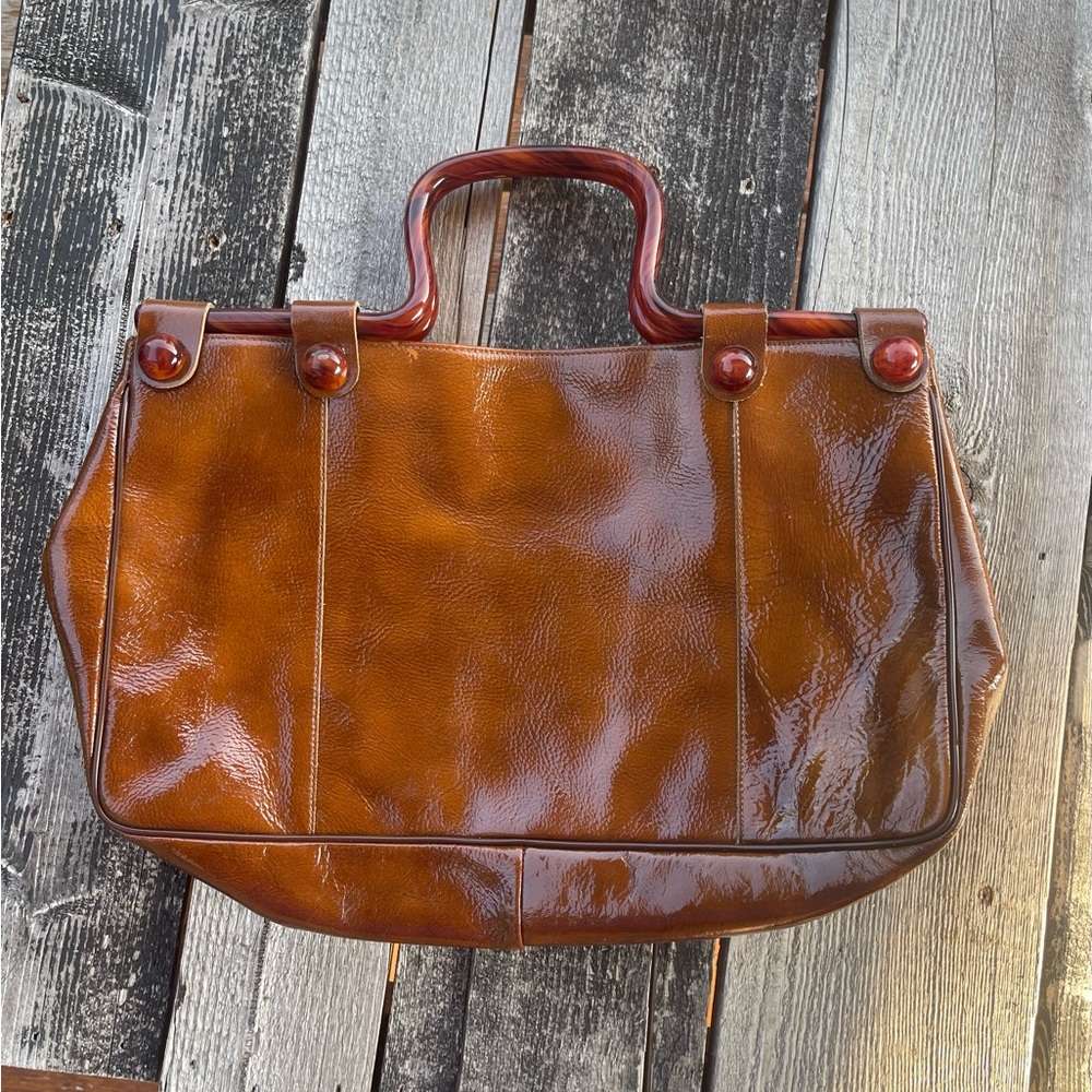 Authentic brown leather purse with beautiful handles.
